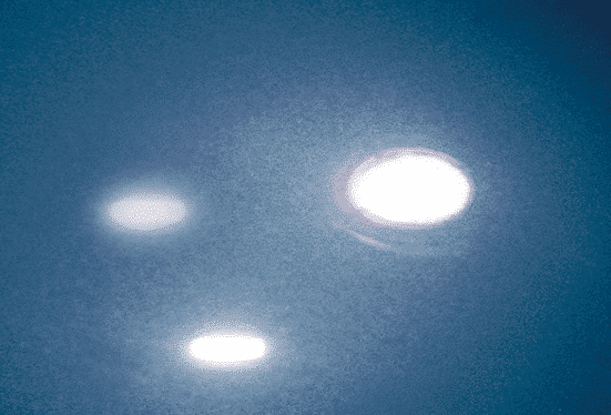 Image showing reflection of strong light source in a surface with low haze