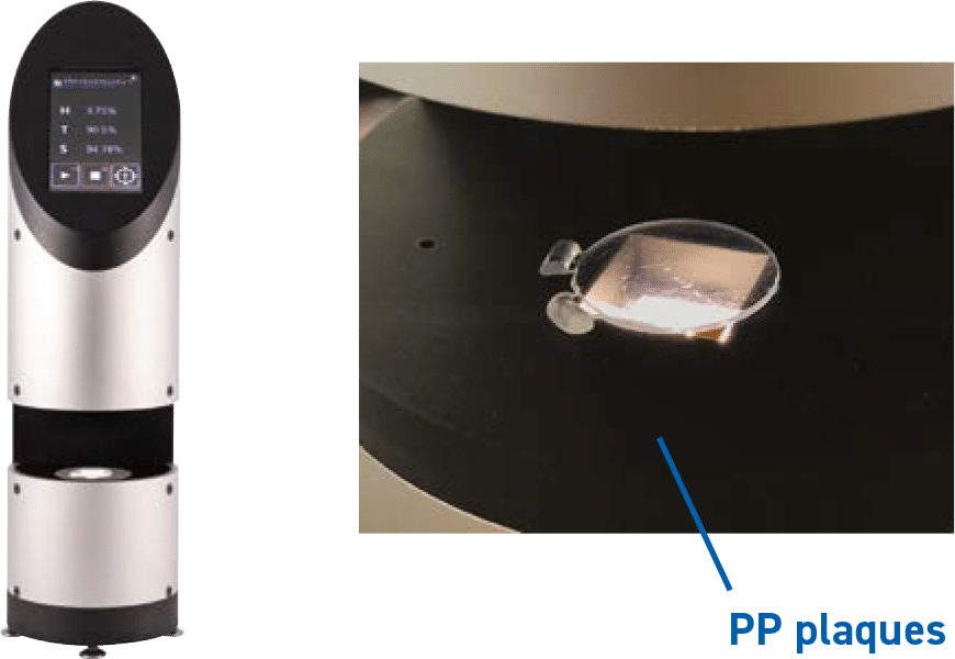 Rhopoint ID instruments with a closeup of plastic plaque placed inside.